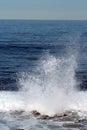Water spray from a wave crashing into rocks in the Pacific Ocean Royalty Free Stock Photo