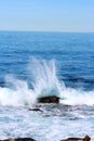 Water spray from wave crashing into rocks in the Pacific Ocean Royalty Free Stock Photo