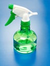 Water sprayer bottle on blue Royalty Free Stock Photo