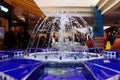 Water spraying out of fountain with blue tile Royalty Free Stock Photo
