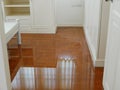 Water spreading / flooding on bedroom parquet floor in a house - damage caused by water leakage