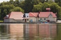 Water station building mooring with rental boats for hire anchored at shore. Recreation concept.