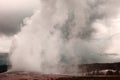 Water and steam explosion of the Old Faithful Geyser, Yellowstone National Park, Wyoming, USA Royalty Free Stock Photo