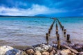 From the water stick piles of destroyed pier Royalty Free Stock Photo