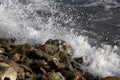 Seawater spatters and rocky stones.