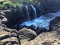 Water Stream Entering Pacific Ocean near Queen`s Bath in Princeville on Kauai Island, Hawaii.