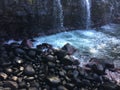 Water Stream Entering Pacific Ocean near Queen`s Bath in Princeville on Kauai Island, Hawaii.