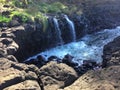 Water Stream Entering Pacific Ocean near Queen`s Bath in Princeville on Kauai Island, Hawaii.