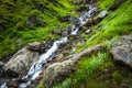A water stream flowing down the mountain. Waterfalls at Shrikhand Mahadev Kailash Himalaya Yatra. Himachal Pradesh India Royalty Free Stock Photo