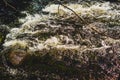 Water stream with foam. falling river water. waterfall flow. abstract water background