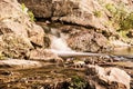 Water stream, long time photo exposure, yellow filter