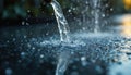 Water streams from nozzle onto wet surface. Clear water drops splash creating texture, reflecting light, forming liquid flow. Royalty Free Stock Photo
