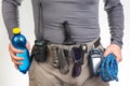 water, sunglasses, walkie-talkie, flashlight, knife, GPS navigator, climbing rope on the belt of the tourist trekking pants.