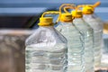 Water supply shortage and climate change threats. Plastic bottles filled with clean water.