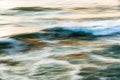 Water surface abstract background. Ocean waves splash, sunset Royalty Free Stock Photo