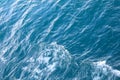 Water surface. Wake waves on the blue sea Royalty Free Stock Photo