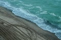 The water surface of the dark sea. Beach. Stormy sea. Waves roll onto the shore. Ocean. Royalty Free Stock Photo