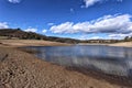 Water surface of loosed lake with gradual sandy banks