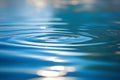 Water surface with ripples and a small splash in the center, reflecting the suns light Royalty Free Stock Photo