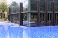 Water surrounds the glass house, adobe rgb