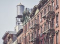 Water tank and fire escapes in downtown New York Royalty Free Stock Photo