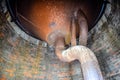 Water tank of old water tower. Rusty tank and pipes of the water system