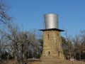 Water tank perched on top of a brick tower Royalty Free Stock Photo