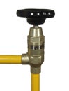 Water tap with black handle and yellow pipes isolated on white b