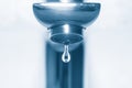 Water tap and falling drop Royalty Free Stock Photo