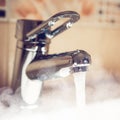 Water tap with hot water steam Royalty Free Stock Photo