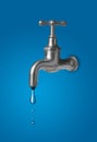 Water tap leaking drop of water - water conservation or saving concept Royalty Free Stock Photo