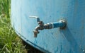 Water tap in an old iron tank on the street. drinking water Royalty Free Stock Photo