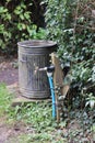 Water tap outside use ,pipe attached to wooden post Royalty Free Stock Photo