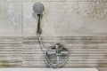 Water tap sink with faucet in expensive loft bathroom. detail of a corner shower cabin with wall mount shower attachment Royalty Free Stock Photo