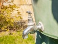 A water tap with a stainless steel valve on the water tank