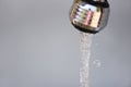 Water tap / Water drop from faucet on gray background Royalty Free Stock Photo