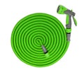 Water taps and a green garden hose with a sprayer Royalty Free Stock Photo