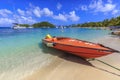 Sleek and powerful water taxi speed boat at idyllic white sand beach of Saltwhistle Bay Mayreau Grenadines