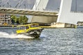 Water taxi under the bridge Royalty Free Stock Photo