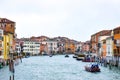 Water Taxis and other boats sailing between Venetian buildings along the Grand Canal in Venice, Italy. Royalty Free Stock Photo