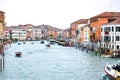 Water Taxis and other boats sailing between Venetian buildings along the Grand Canal in Venice, Italy. Royalty Free Stock Photo