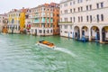 Water taxis/ taxicabs sailing on water between buildings in the Grand Canal, Venice, Italy