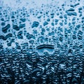 Water texture abstract background, aqua drops on blue glass as science macro element, rainy weather and nature surface art Royalty Free Stock Photo
