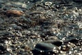 Water texture background. Sea water fast flow in the stones. Nature closeup Royalty Free Stock Photo
