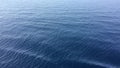 Water texture in the Mediterran sea. Crystal clear water of Adriatic Sea sparkle in the bright morning sun. Little sea waves rolli