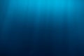 Water texture in underwater and sun rays. Blue ocean in underwater Royalty Free Stock Photo