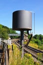 Water tower alongside railway line.