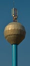 Water tower with antennas on top of it Royalty Free Stock Photo