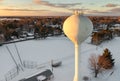 Water Tower Looms Over Winter Ball Park at Sunset Royalty Free Stock Photo