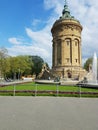 Water Tower  Mannheim  on a clear day. There are many people out for rest.  Mannheim Germany   04-18-2016 Royalty Free Stock Photo